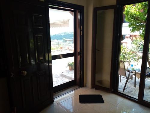 an open door with a view of a patio at MARY'S HOUSE in Paliouri