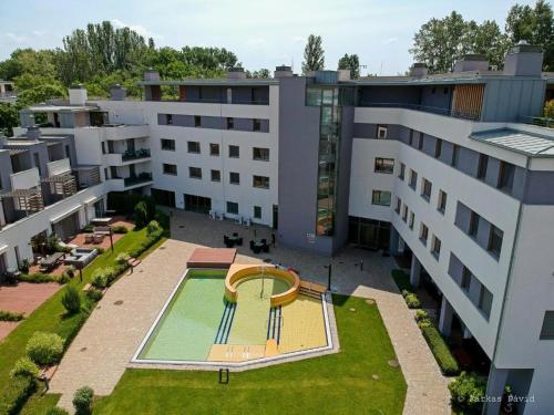 an aerial view of a building with a pool at Silver DeLux Apartman in Balatonfüred