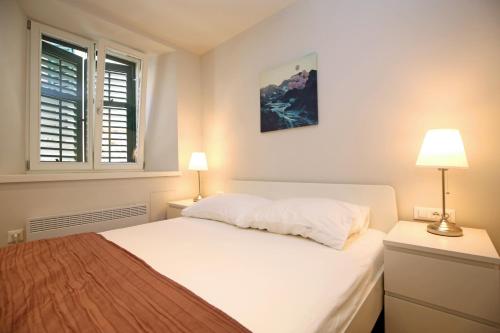 Postel nebo postele na pokoji v ubytování Apartment Volat