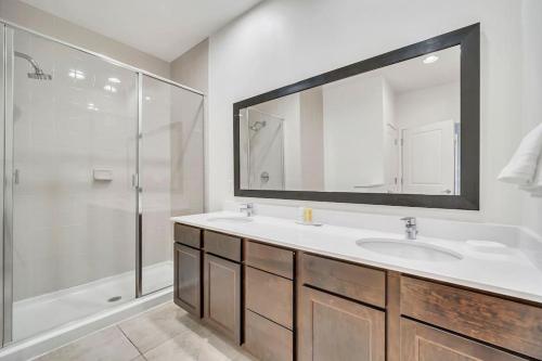 a bathroom with a sink and a shower at Regal Oaks Resort Townhouse in Kissimmee