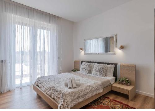 Кровать или кровати в номере Luxury apartment Malpensa