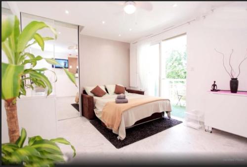 a bedroom with a bed and a large mirror at Superbe Studio in Cannes 450m sea & parking in Cannes