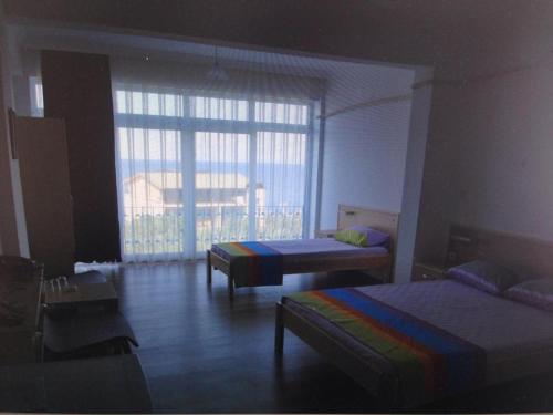 Ένα ή περισσότερα κρεβάτια σε δωμάτιο στο Marmada otel