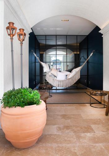 a hammock in the middle of a room at Riva Marina Hvar Hotel in Hvar