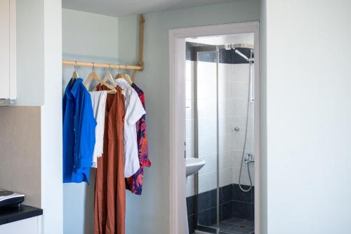 a bathroom with a towel rack and a shower at Serenity Hideaway in Palaiochóra