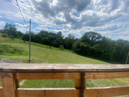 a view of a field from a wooden fence at Zajazd Tadeo in Pietrzykowice