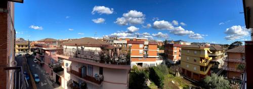 a group of buildings on a city street at Oasi di Serenità in Marino
