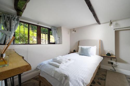 Ένα ή περισσότερα κρεβάτια σε δωμάτιο στο Summergreen Farmhouse