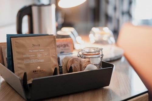 a box with a glass jar on top of a counter at The Fox & Goose Hotel in London