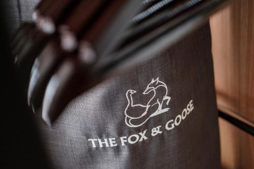 a black towel with the fox and google logo on it at The Fox & Goose Hotel in London