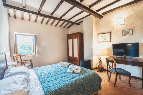 Una cama o camas en una habitación de Hotel Della Fortezza