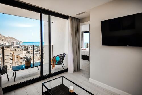 a living room with a view of the ocean at HO Aguadulce By Olivencia in Aguadulce