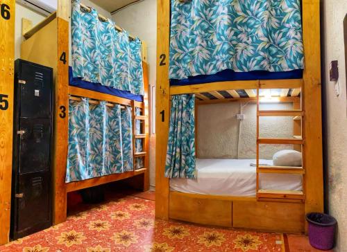 a bedroom with two bunk beds and a doorway at Garra Charrua in Mérida