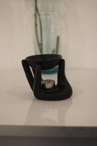 a black object sitting on top of a table at Hotel Boutique Casona de Santa Clara in Puebla