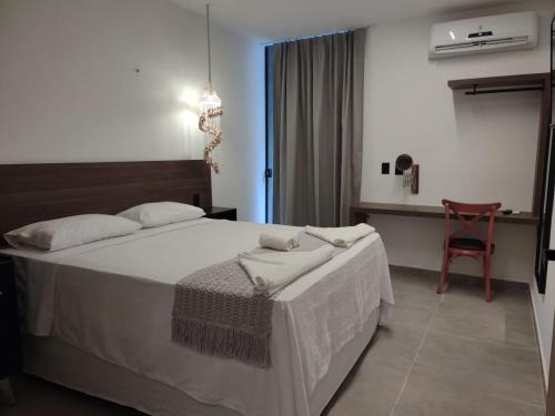 Ένα ή περισσότερα κρεβάτια σε δωμάτιο στο Maly Boutique Hotel