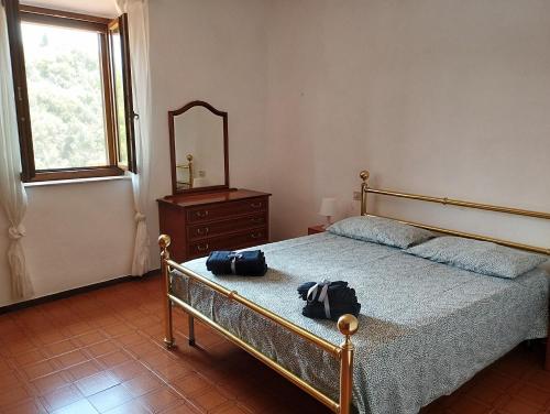 Ліжко або ліжка в номері La casina di Boscalto