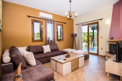 a living room with a couch and a coffee table at VILLA IRIDA in Kefallonia