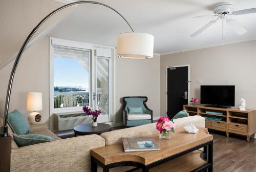 a living room with a couch and a table at Opal Key Resort & Marina in Key West