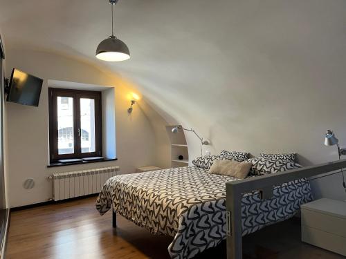 a bedroom with a bed and a window at Il Nido Etrusco in Orvieto
