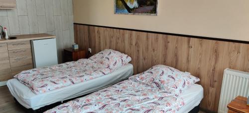 Posteľ alebo postele v izbe v ubytovaní Apartmán Hradná 9