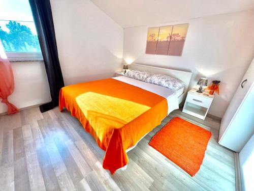 Postel nebo postele na pokoji v ubytování Barbariga apartments