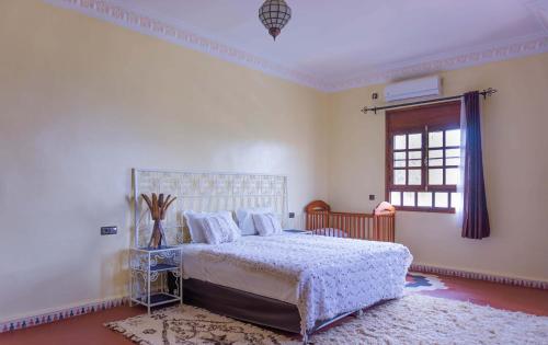 Postel nebo postele na pokoji v ubytování Riad Zagora Palms
