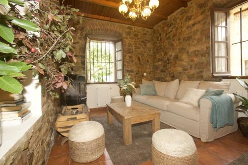 a living room with a couch and a table at Casa Rural Casa Selmo in Carreno