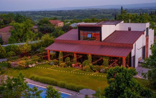 an aerial view of a house with a garden at Giuaani Winery in Manavi