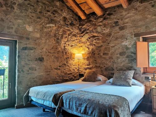 Letto o letti in una camera di Can Gasparó HotelRural&Restaurant