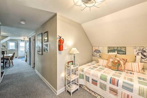 a bedroom with a bed and a dining room at Wildwood Crest Apartment, half Mi to the Beach in Wildwood Crest