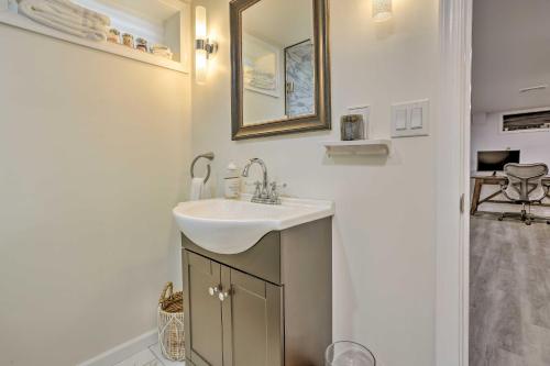 a bathroom with a sink and a mirror at Saddle Brook Studio with Patio - Near NYC! in Saddle Brook