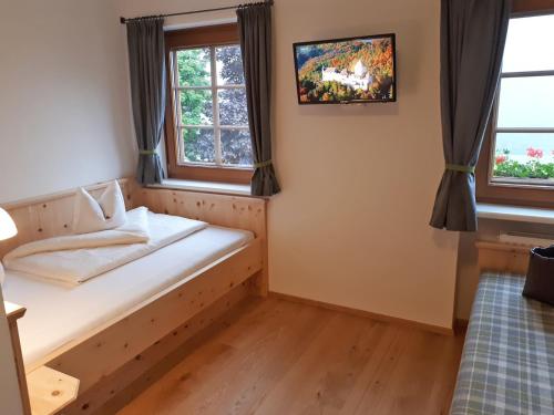 Ein Bett oder Betten in einem Zimmer der Unterkunft Hotel Weiler - Aktiv & Tradition