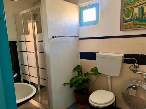 a bathroom with a toilet and a sink at Casa Amador Charming 2 bedrooms house in Alcacer in Alcácer do Sal