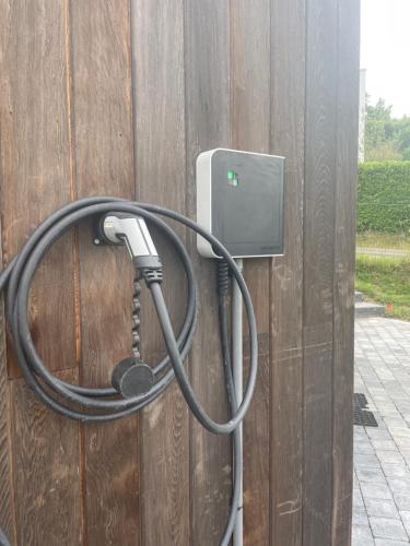 a hose is hooked up to a wall at La Huche in Namur