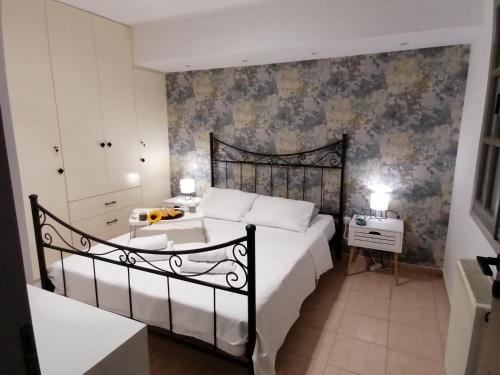 a bedroom with a bed and a table in it at petite nafplio sofos apartment in Nafplio