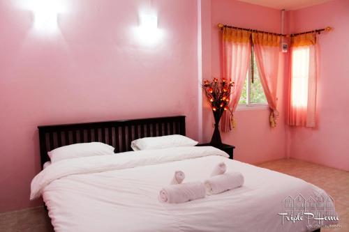 Postel nebo postele na pokoji v ubytování Triple P Home Resort