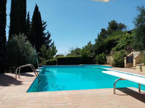 a swimming pool with a slide in a yard at Gervasella in Pontedera