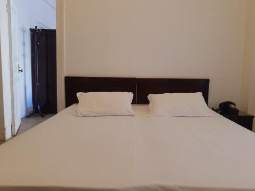 Palace Hotel - Poços de Caldasにあるベッド