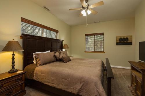 a bedroom with a bed and a ceiling fan at 984 Pine Valley Forest Lakes in Vallecito