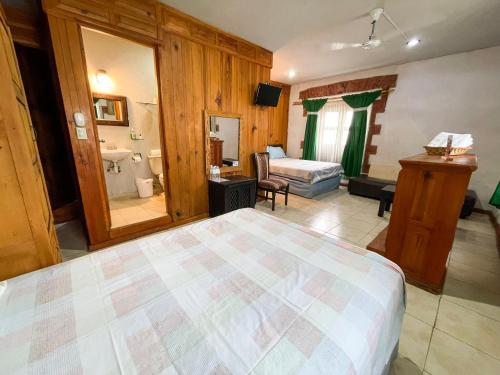 Una cama o camas en una habitación de Hotel Vitorina