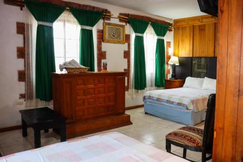 Una cama o camas en una habitación de Hotel Vitorina