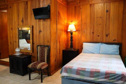 Una cama o camas en una habitación de Hotel Vitorina