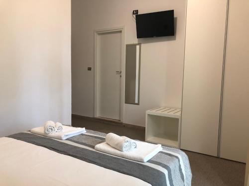 Postel nebo postele na pokoji v ubytování Vinsea Hotel