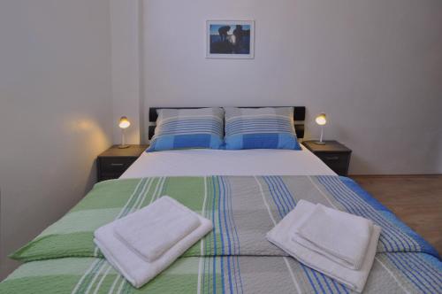 Postel nebo postele na pokoji v ubytování Apartment Nemo