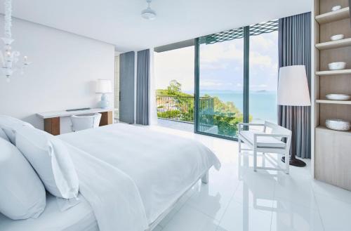 Postel nebo postele na pokoji v ubytování COMO Point Yamu, Phuket