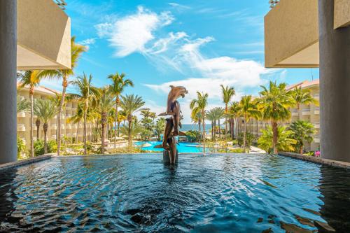 a statue in the pool at the resort at Barceló Gran Faro Los Cabos in San José del Cabo