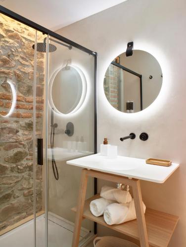 a bathroom with a sink and a shower at LD Convento Cister in Málaga