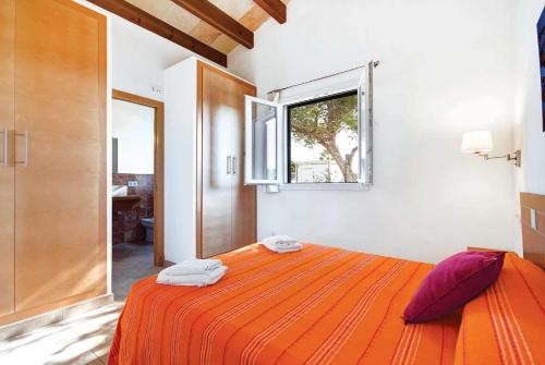 Un pat sau paturi într-o cameră la Es Romani