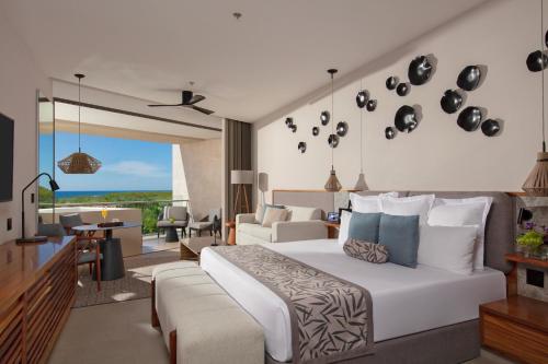 Postel nebo postele na pokoji v ubytování Secrets Bahia Mita Surf and Spa - All Inclusive - Adults Only