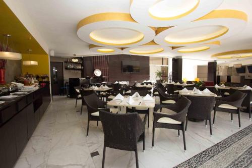 a dining room with tables and chairs in a restaurant at Casa Francisco in Cuernavaca